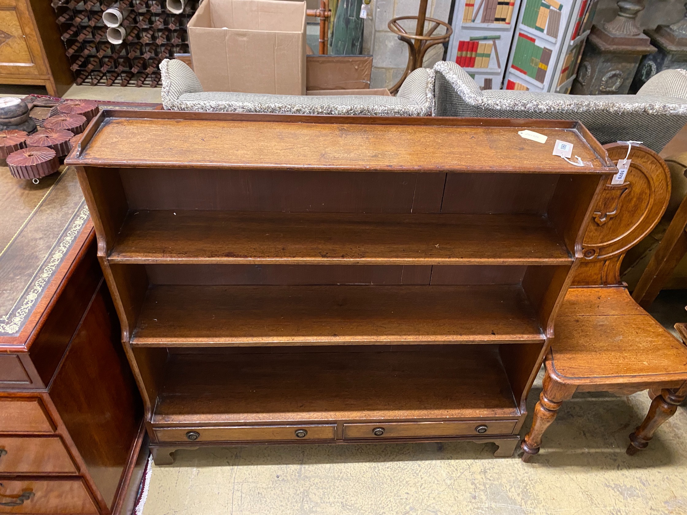 A 19th century slender mahogany graduated dwarf open bookcase, width 108cm, depth 26cm, height 99cm